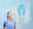 Nurse looking up to screen showing human form