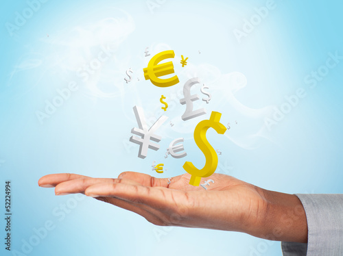 Photo: Businessman with currencies in his hand Businessman with currencies in his hand