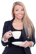 Happy blond woman drinking from a white cup