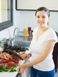  housewife with raw seafood