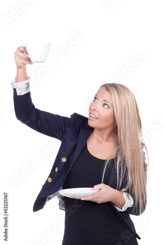 Photo: Attractive blonde holding teacup and saucer Attractive blonde holding teacup and saucer