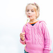 girl blowing dandelion