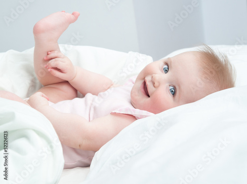 Photo: baby playing with his feet baby playing with his feet