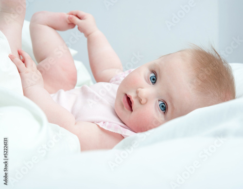 Photo: baby playing with his feet baby playing with his feet