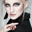 A photo of beautiful girl is in fashion style on grey background