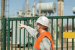 Electrician indicates to the transformer