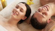 happy couple relaxing in spa salon