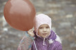little girl with red balloon