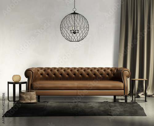 Illustration: Classic brown leather sofa, dark rug with stools, ceiling lamp Classic brown leather sofa, dark rug with stools, ceiling lamp
