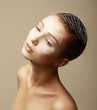 Photo: Girl with Faceart. Fashion Model with Creative Bronze Makeup Girl with Faceart. Fashion Model with Creative Bronze Makeup