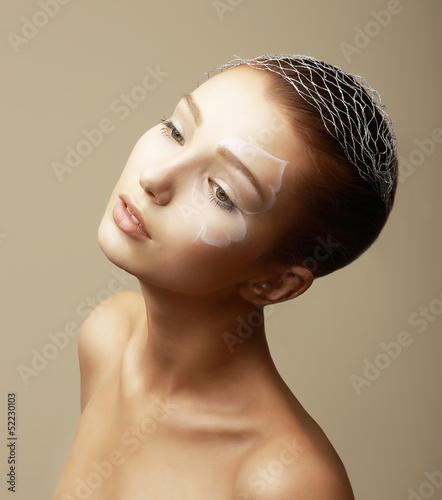 Photo: Girl with Faceart. Fashion Model with Creative Bronze Makeup Girl with Faceart. Fashion Model with Creative Bronze Makeup
