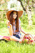 Beautiful woman in the garden with apples