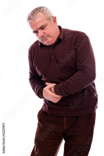 Photo: Senior man suffering from abdominal pain Senior man suffering from abdominal pain