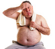 Overweight man resting, tired after training, with hand on foreh