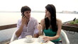 Happy couple having breakfast on italian lake in vacation