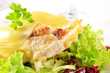 Cheese topped fish fillets with salad