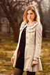 Photo: young woman in autumn garden young woman in autumn garden