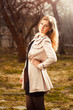 Photo: young woman in autumn garden young woman in autumn garden