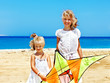 Photo: Kid flying kite outdoor. Kid flying kite outdoor.