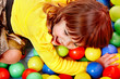 Child in group colourful ball.