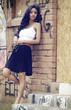 Beautiful young woman lwall with graffiti