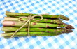 Green asparagus on blue and white checkered background