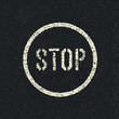 Stop sign painted on a asphalt road. Vector