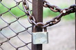 Photo: Lock on a chain link security fence. Lock on a chain link security fence.