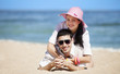 Photo: Beautiful couple on the beach Beautiful couple on the beach