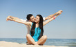 Foto: Beautiful couple on the beach Beautiful couple on the beach