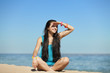 Foto: Beautiful girl at the beach Beautiful girl at the beach