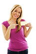 Photo: Beautiful smiling woman pointing at blank gift card sign Beautiful smiling woman pointing at blank gift card sign