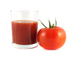 Red ripe tomato with glass of tomato juice