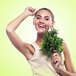 woman with bundle herbs (salat). Concept vegetarian dieting