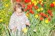 Photo: child playing in flower garden child playing in flower garden