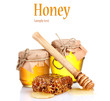 Photo: Two jars of honey and honeycombs isolated on white Two jars of honey and honeycombs isolated on white
