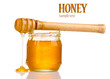 Jar of honey isolated on white