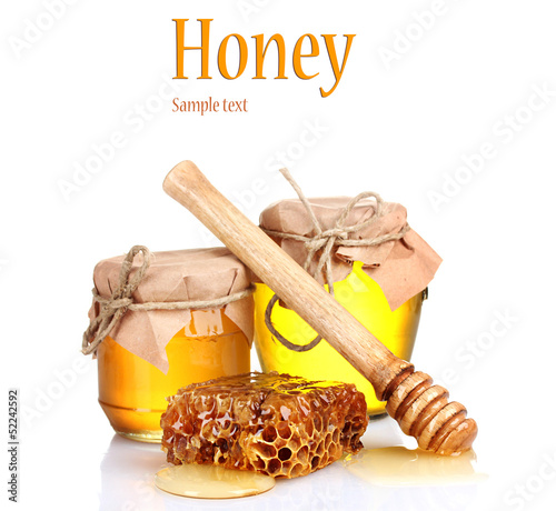 Photo: Two jars of honey and honeycombs isolated on white Two jars of honey and honeycombs isolated on white