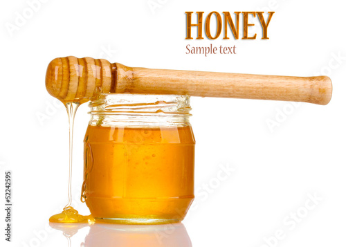 Photo: Jar of honey isolated on white Jar of honey isolated on white