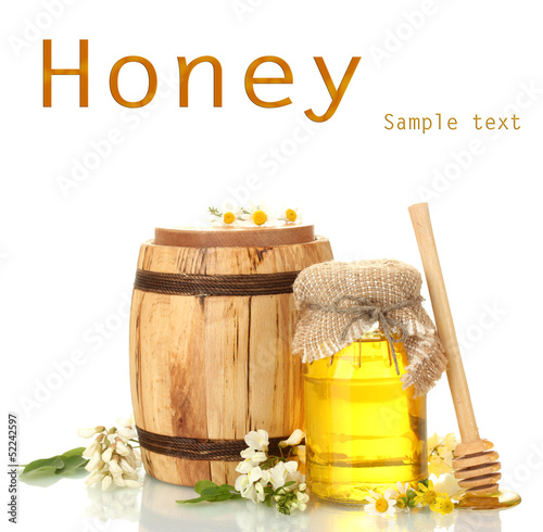 Photo: Honey in bank and barrel isolated on white Honey in bank and barrel isolated on white