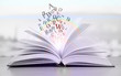Foto: Opened book on bright background Opened book on bright background