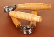 Modern hand trainer on brown background