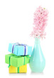 Photo: Beautiful hyacinth in vase and beautiful gifts, isolated Beautiful hyacinth in vase and beautiful gifts, isolated