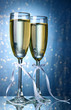 Two glasses of champagne on bright background with lights