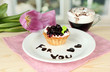 Sweet cake with blackberry and chocolate sauce