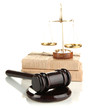 Golden scales of justice, gavel and books isolated on white