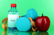 Dumbbells on green background