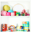 Beautiful white shelves with thread and material for
