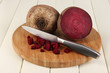 Sliced beetroot on board on wooden table close-up