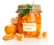 Orange jam with zest and tangerines, isolated on white